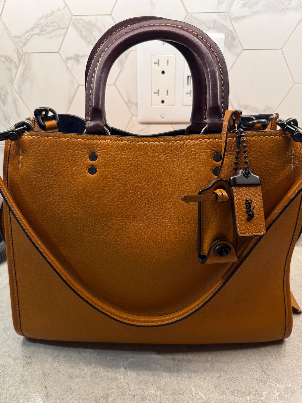EUC and HTF Coach Rogue 30 31 in Butterscotch Oxblood Colorblock